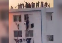 Estudantes se penduram e caem de prédio durante incêndio; um morreu. Veja vídeo